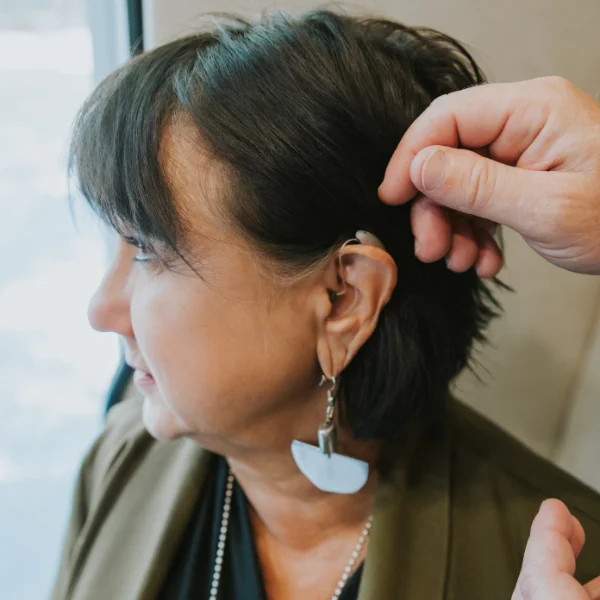 a hearing aid in a patients ear